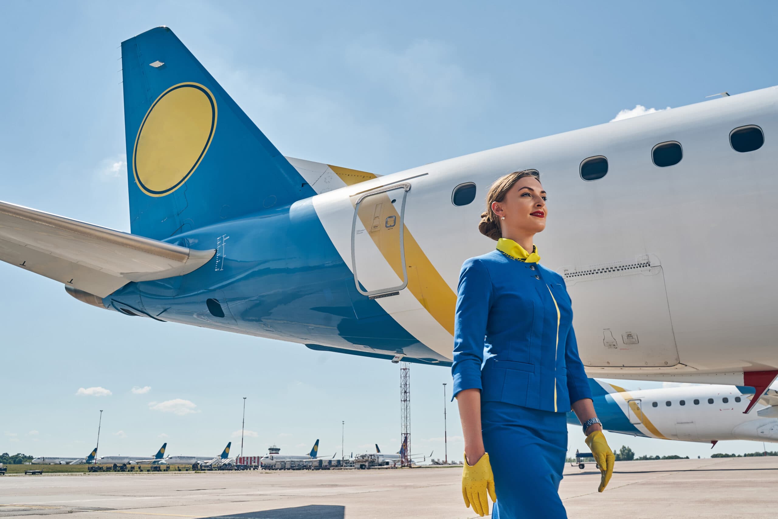 Cabin crew professional looking confidently into the distance.